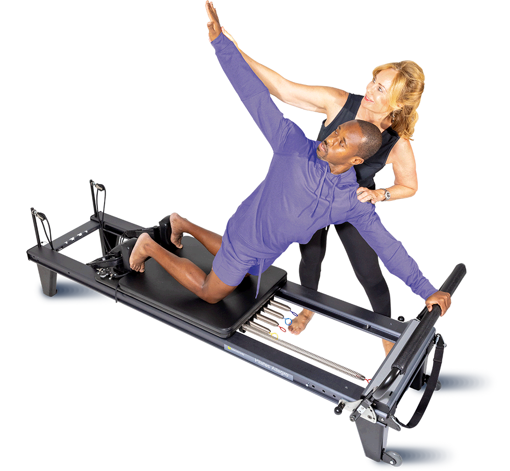 Pilates Instructor with a Student Pilates Teacher on the Reformer